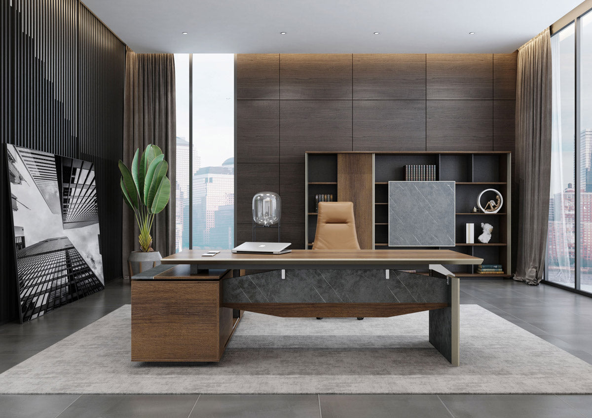 2.0m Executive office desk with return, brown oak color, featuring metal brackets, cable management and a modern design with a bookcase and a large window in the background.